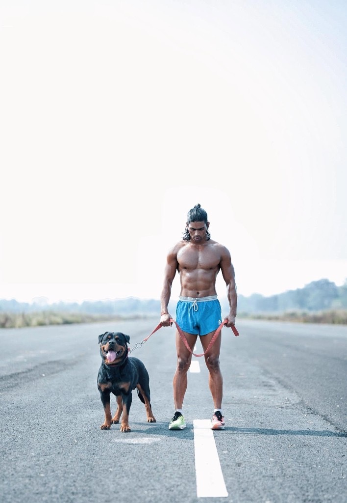 Raja Yadav on the road with his Rottweiler